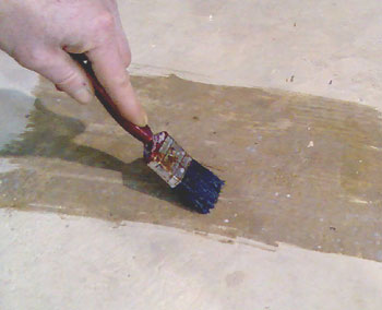 Brushing clear Epoxy Seal Coat onto concrete - clean concrete well first