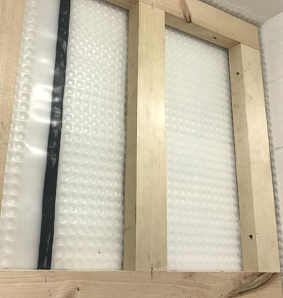 Kontract Membrane behind a stud frame - no plugs required